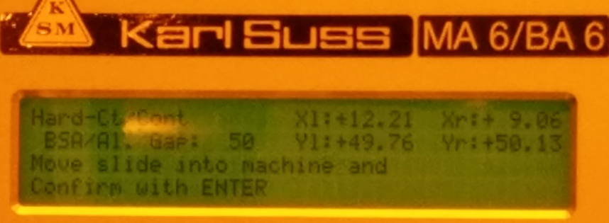 Gently push the slide into the machine and press ENTER. The machine ...